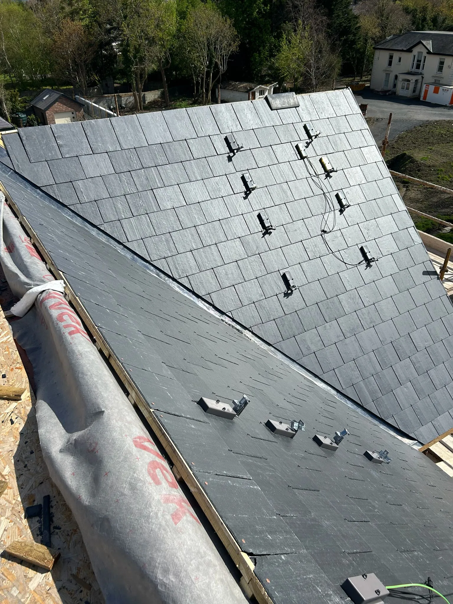 New Spanish slates on a new roof, solar panel brackets fitted — photo 2