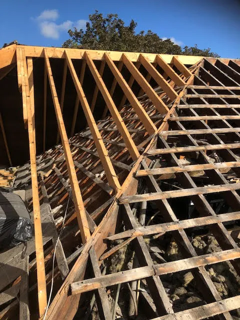 Roof being replaced. Existing Bangor slates on the front and side slopes. New Spanish slates on the back — photo 3