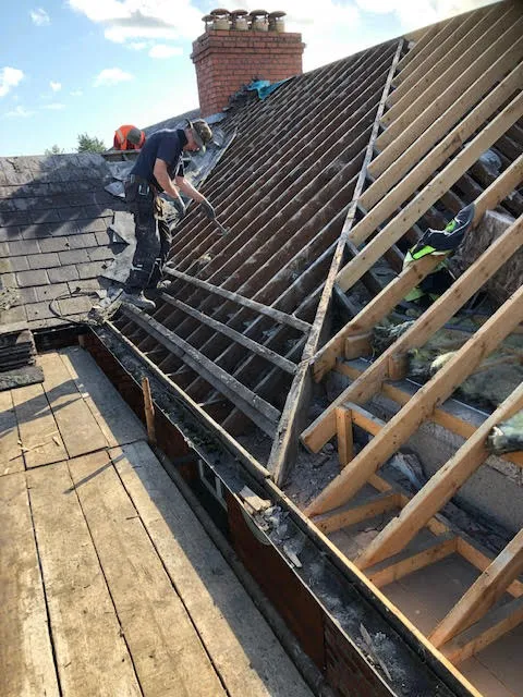 Roof being replaced. Existing Bangor slates on the front and side slopes. New Spanish slates on the back — photo 6