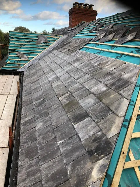 Roof being replaced. Existing Bangor slates on the front and side slopes. New Spanish slates on the back — photo 15