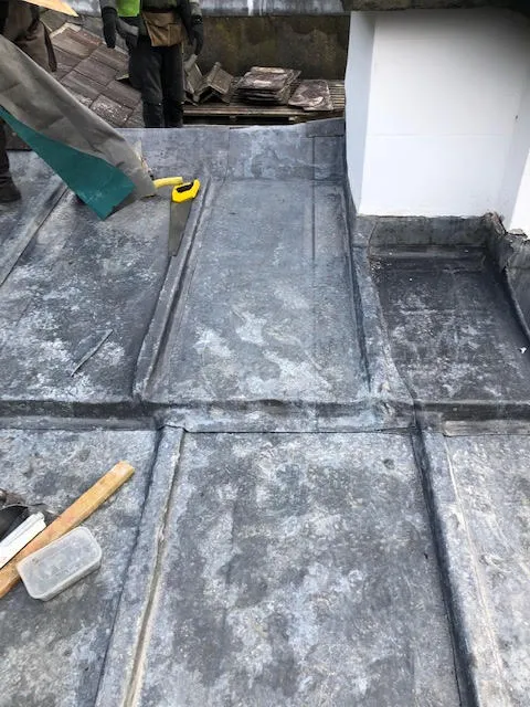 An old lead flat roof and it being replaced — photo 10